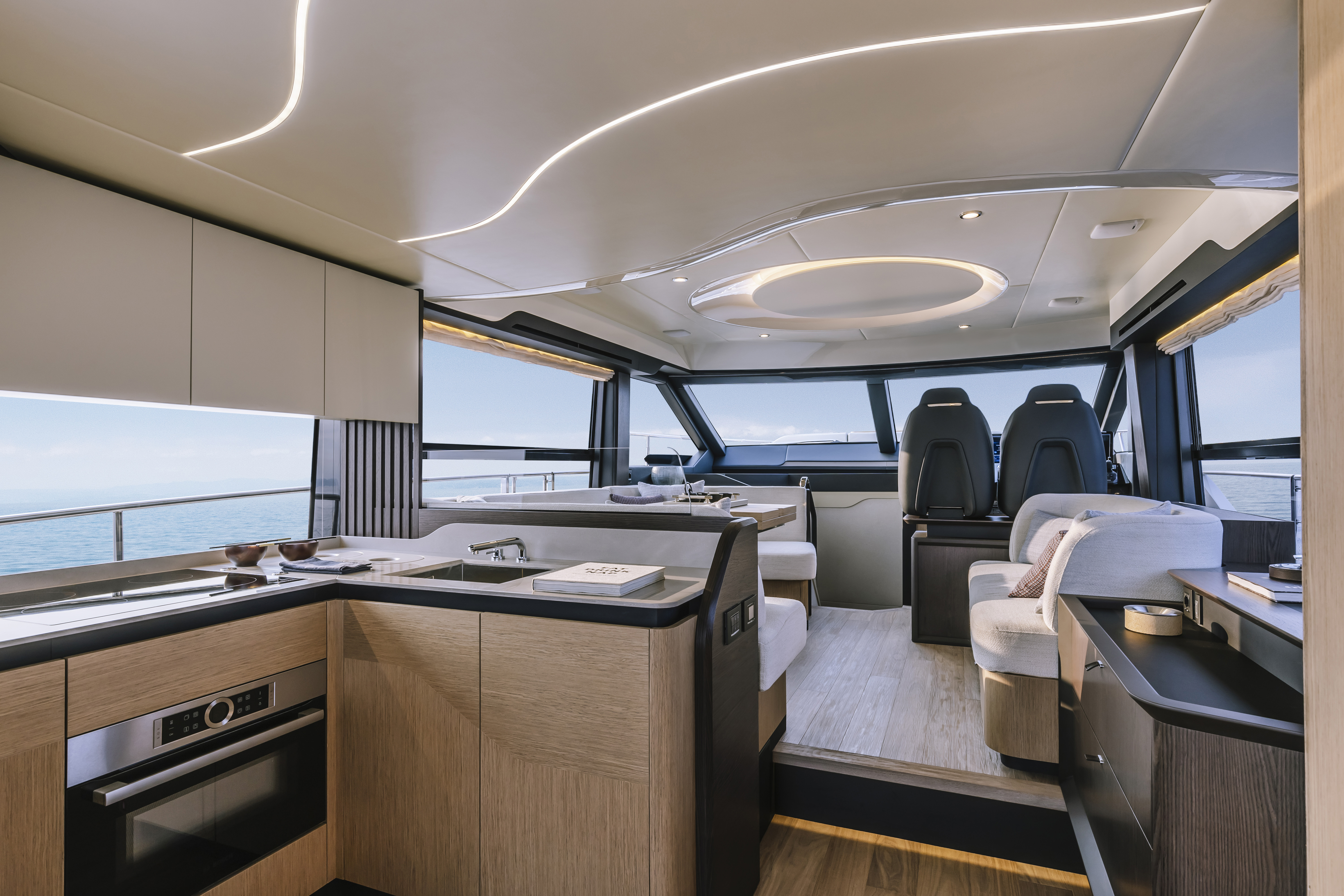 52 FLY cockpit aft sofa — teak table, drinks
