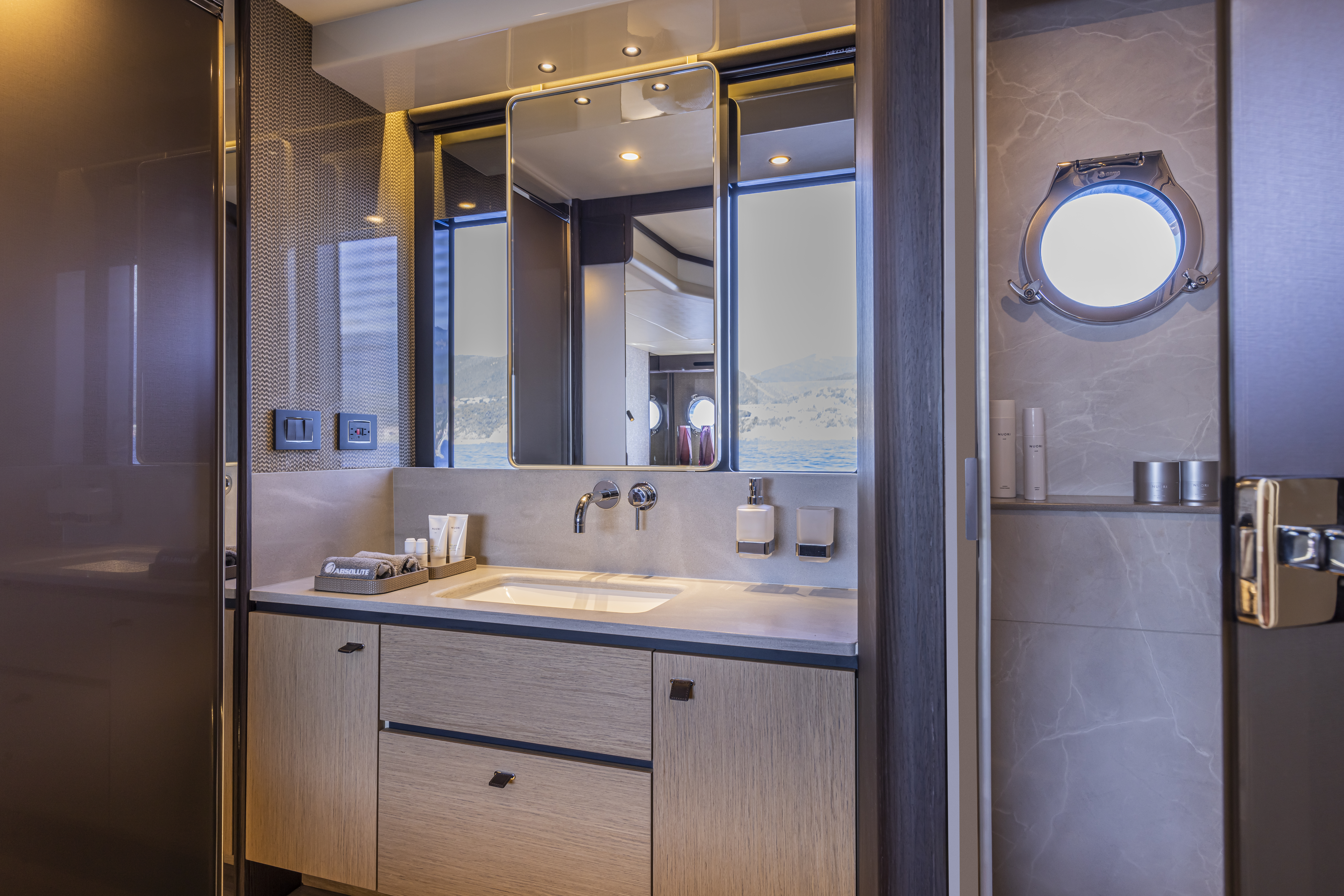 56 FLY owner's bathroom — vanity, mirror, portlight