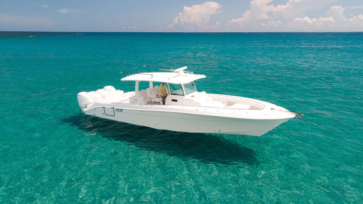 HCB 42 Lujo — navy hull running aft, triple Racing 450, New England coast
