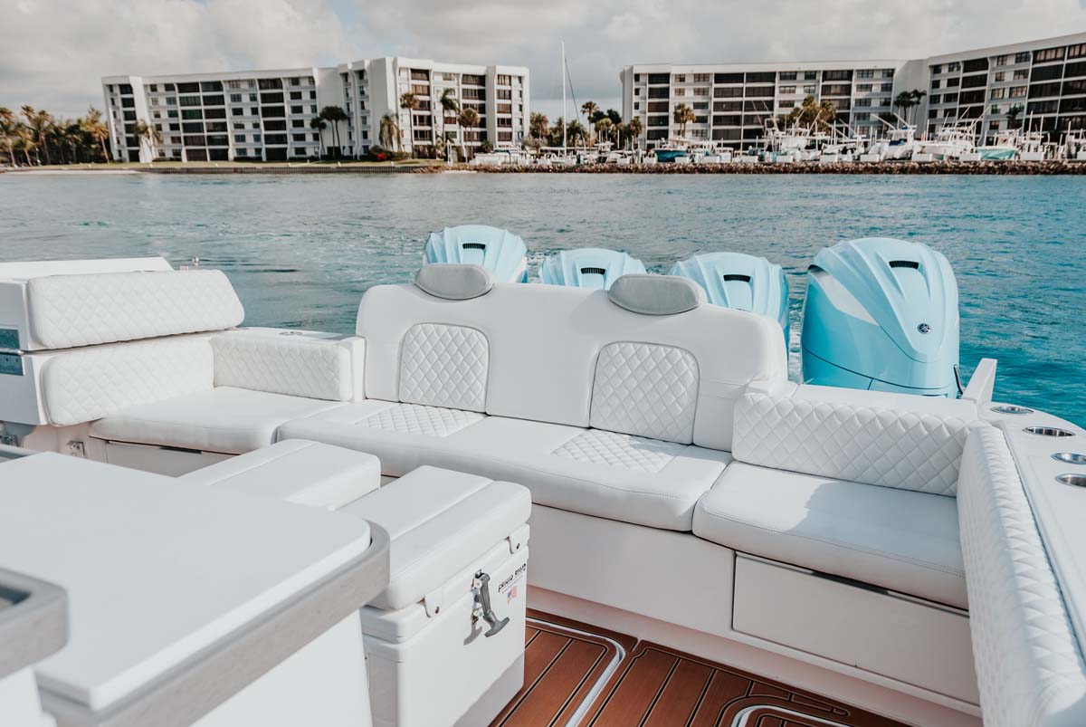 HCB 42 Lujo helm close — walnut wheel, Garmin chartplotter