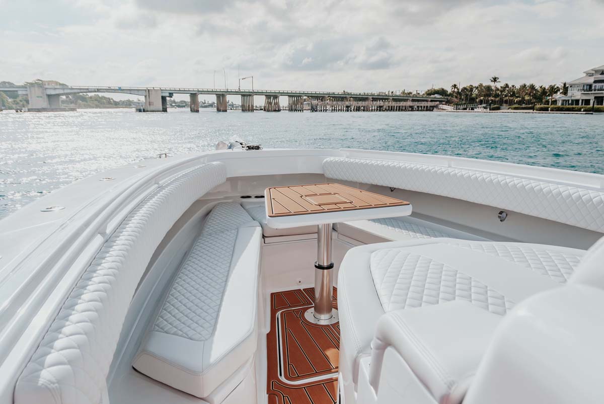 HCB 42 Lujo cockpit — white hull, baby blue Mercury outboards