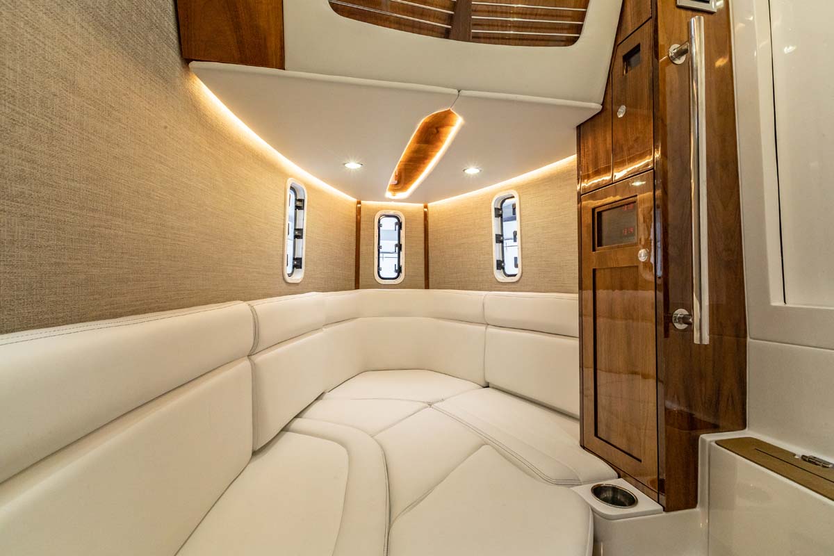 HCB 42 Lujo — aerial top-down, turquoise Bahamas, guests on bow