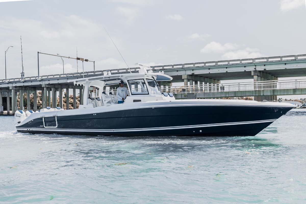 HCB 42 Lujo — navy hull full starboard profile, New England harbour