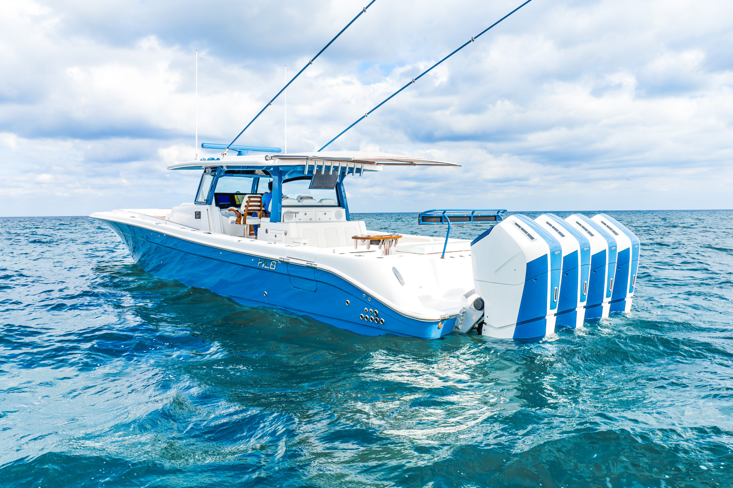 HCB 53 Sueños RXV — blue hull, five custom blue outboards, offshore at rest