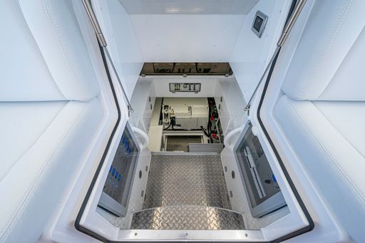 HCB 65 Estrella — top-down aerial at night, six outboards, full teak deck layout visible