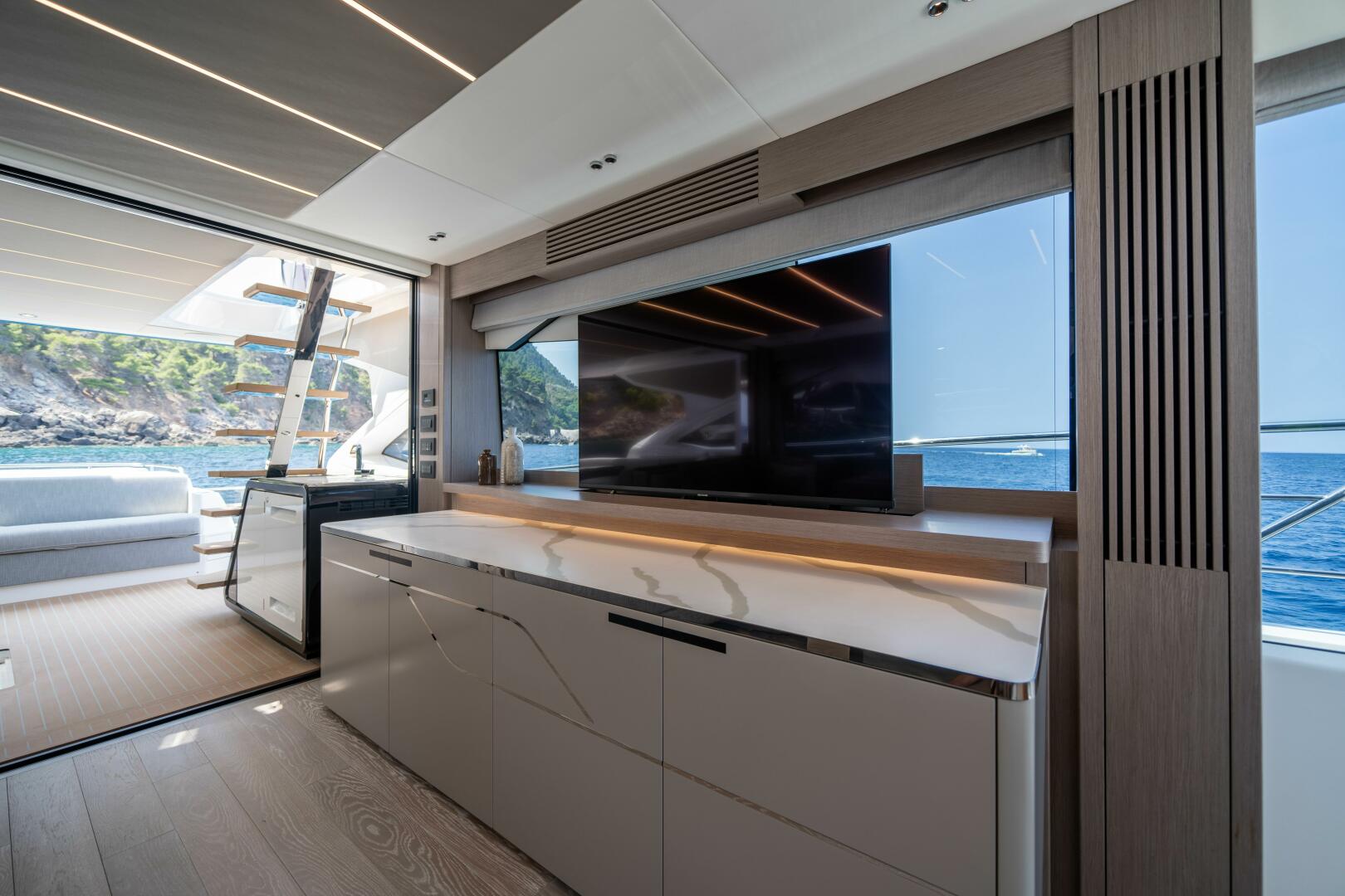 75 Sport Yacht — main saloon, mood lighting, full glazing
