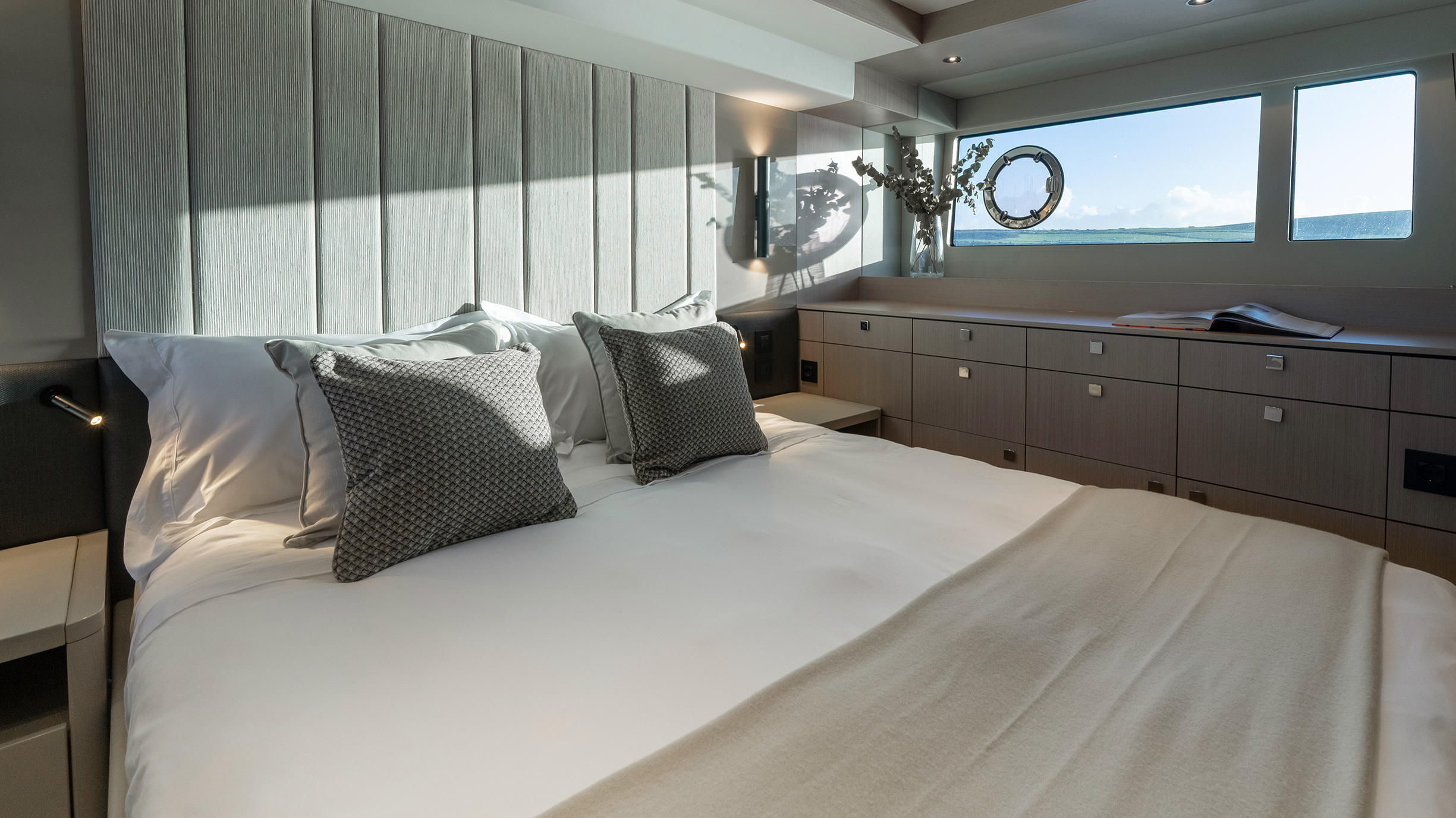 Sunseeker Manhattan 56 — master cabin close, headboard detail, panoramic window, vanity