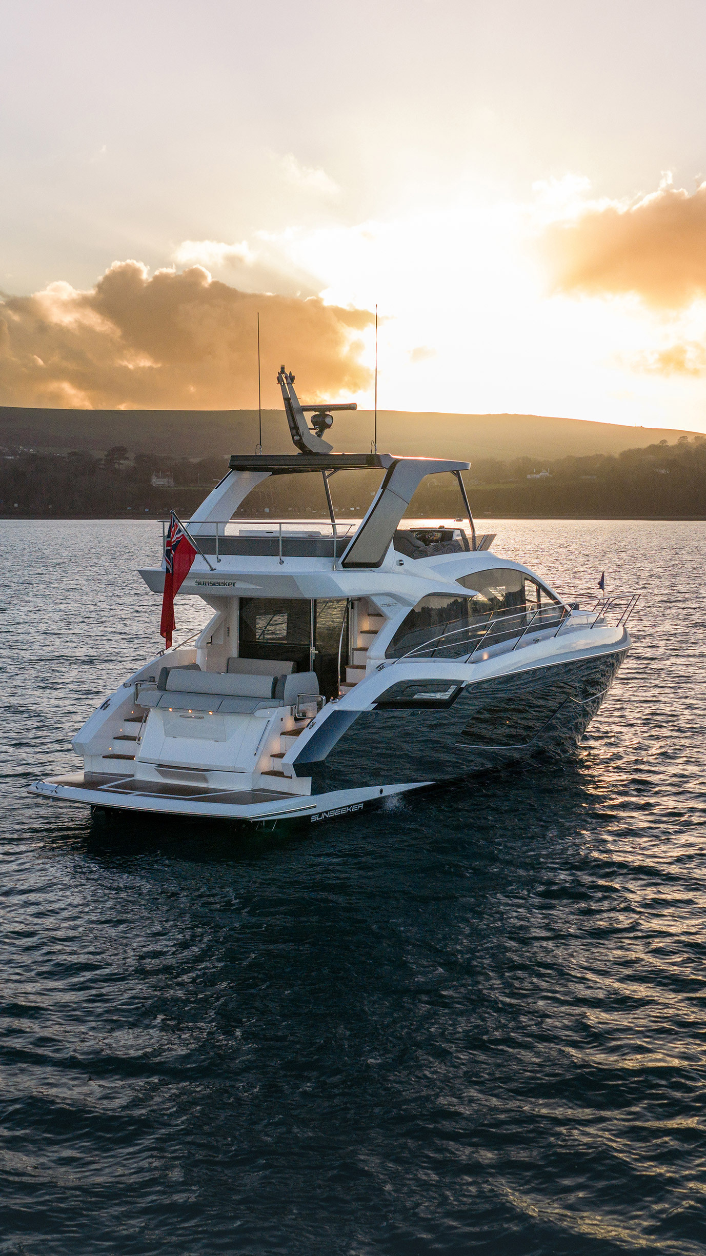Sunseeker Manhattan 56 — aft portrait at sunset, SUNSEEKER transom, Dorset hills