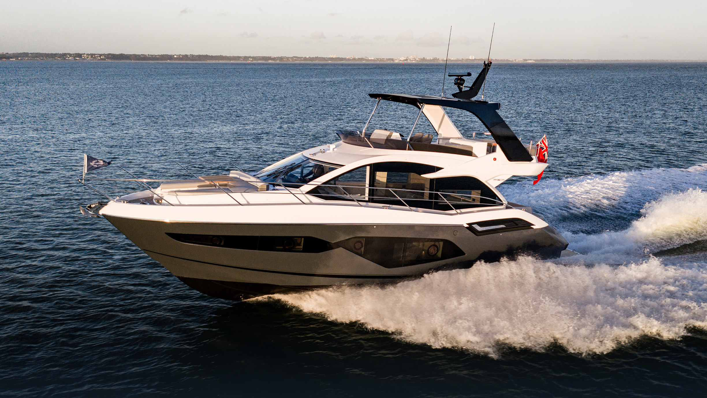 Sunseeker Manhattan 56 — starboard bow running hard, full wake, Poole Harbour
