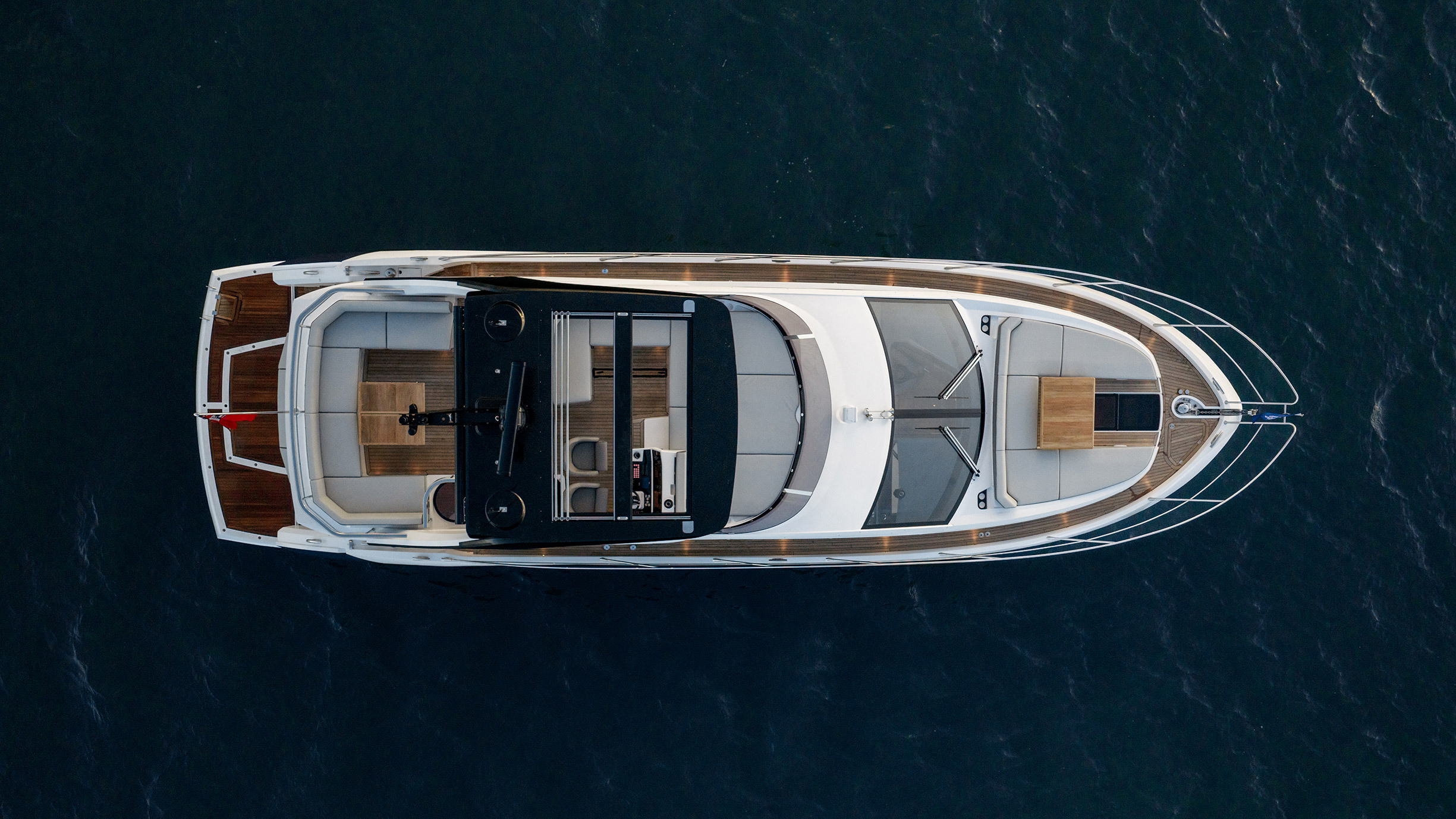 Sunseeker Manhattan 56 — top-down aerial at rest, cockpit, flybridge and foredeck layout