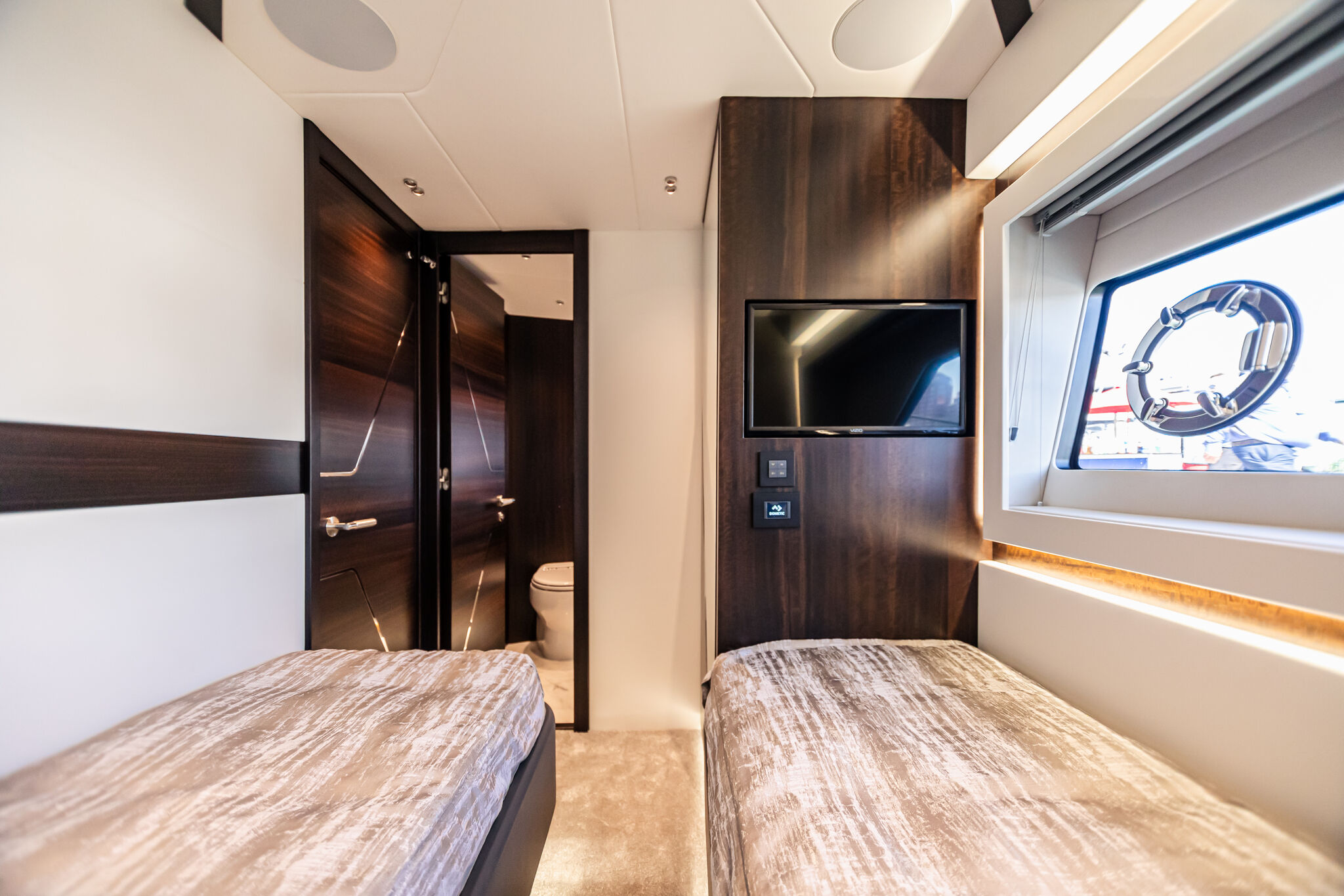 Predator 65 — aft cockpit social bar configuration, bar unit, stools, sunpad over garage