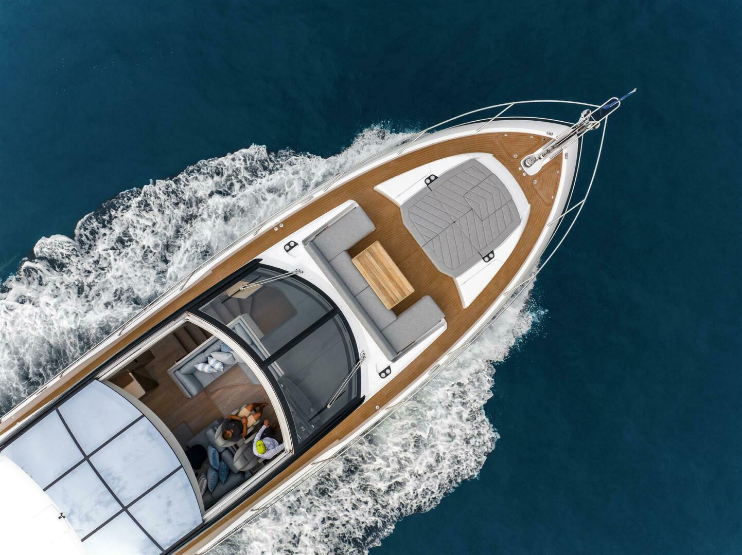 Predator 75 — main deck saloon, wrap-around seating, full glazing