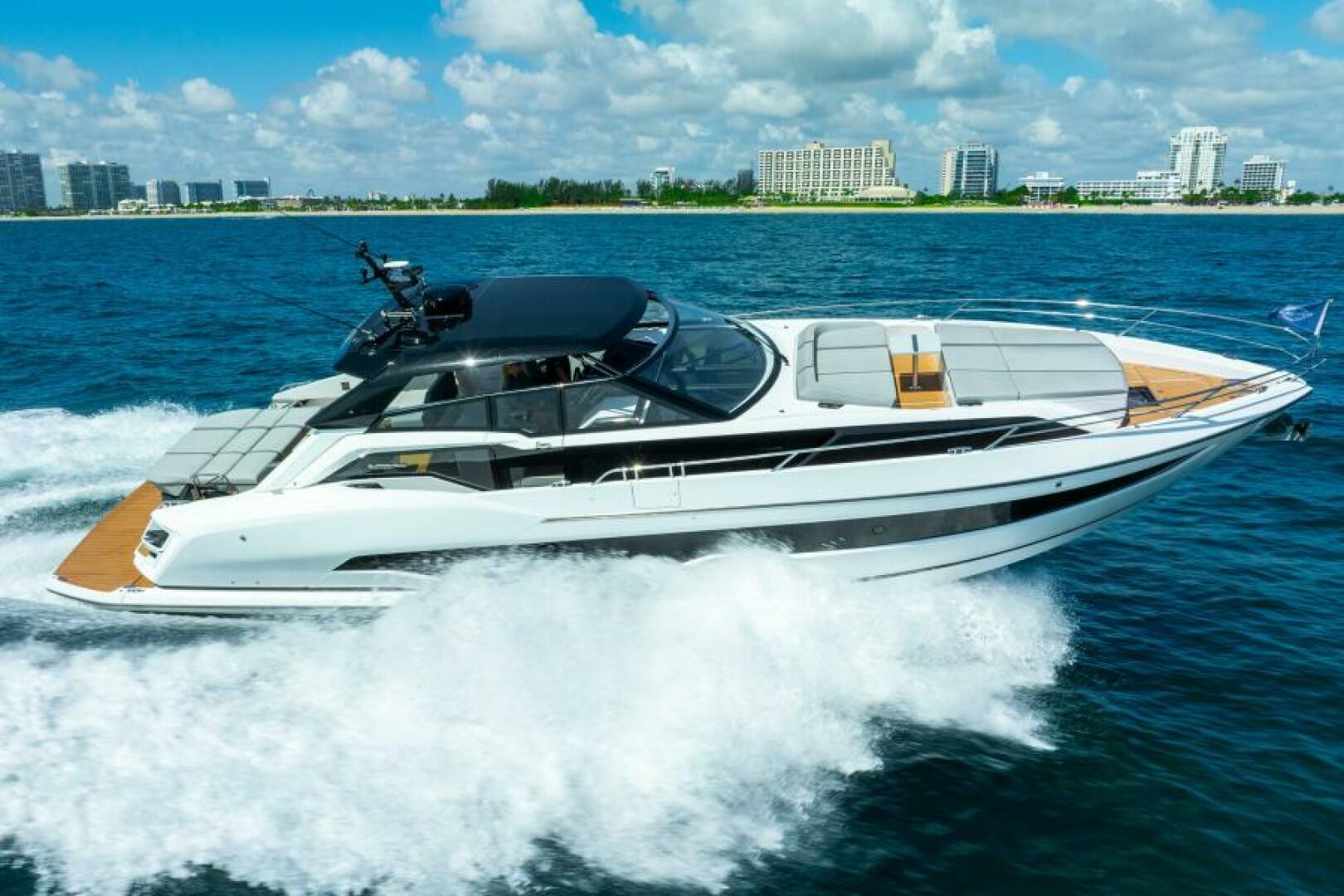 Sunseeker Superhawk 55 — aft running, Miami Beach skyline, full wake