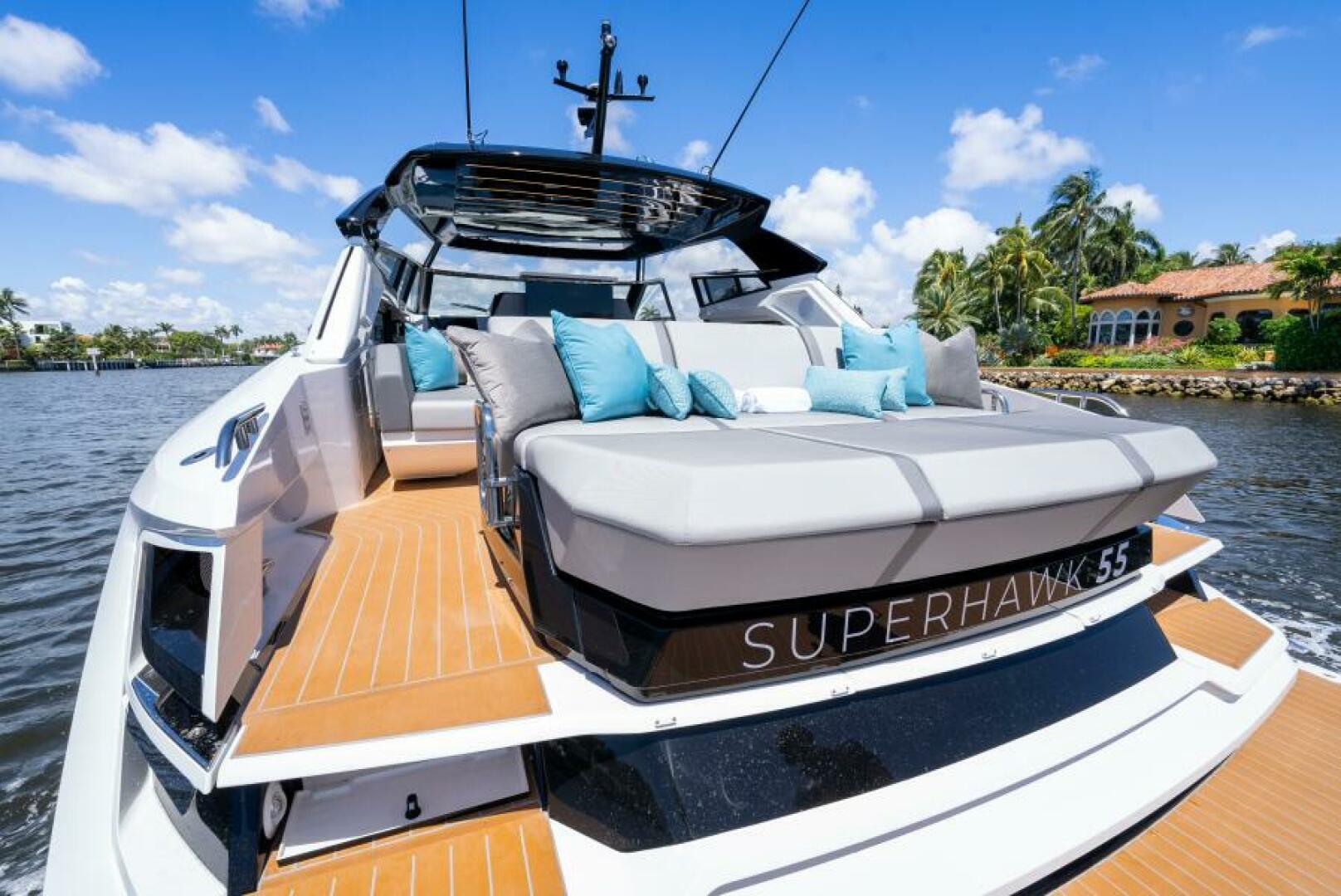 Sunseeker Superhawk 55 — cockpit social seating, open roof panel, intracoastal