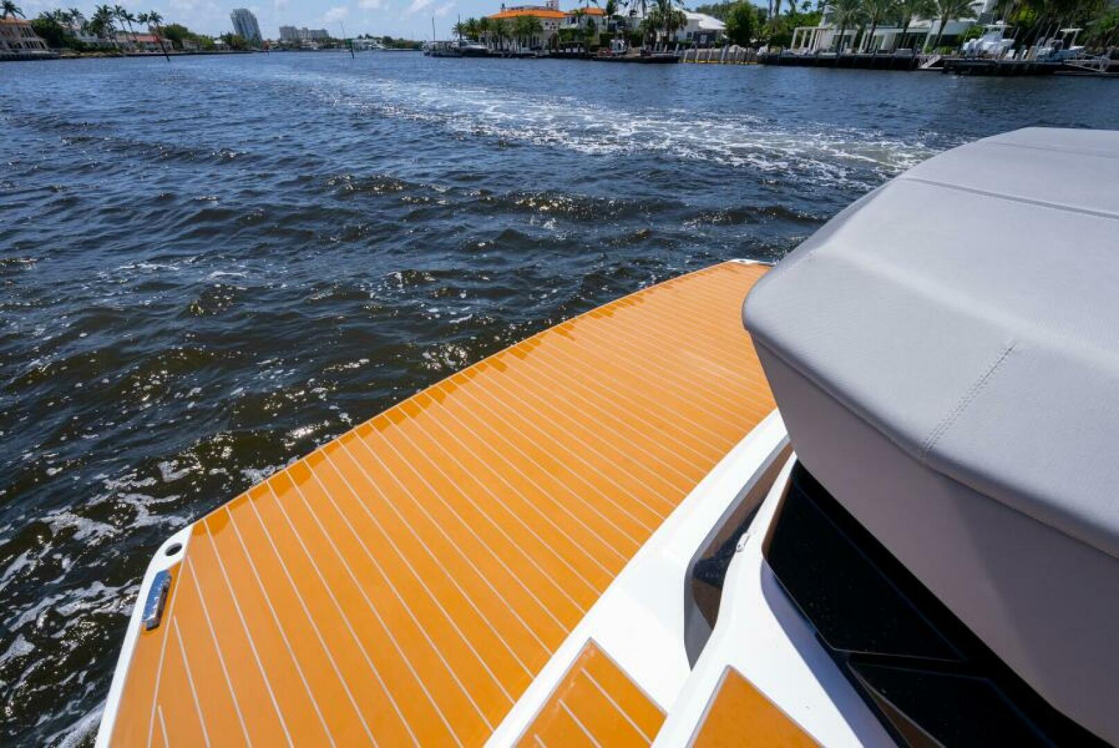 Sunseeker Superhawk 55 — wet bar island, TV raised, roof fully open