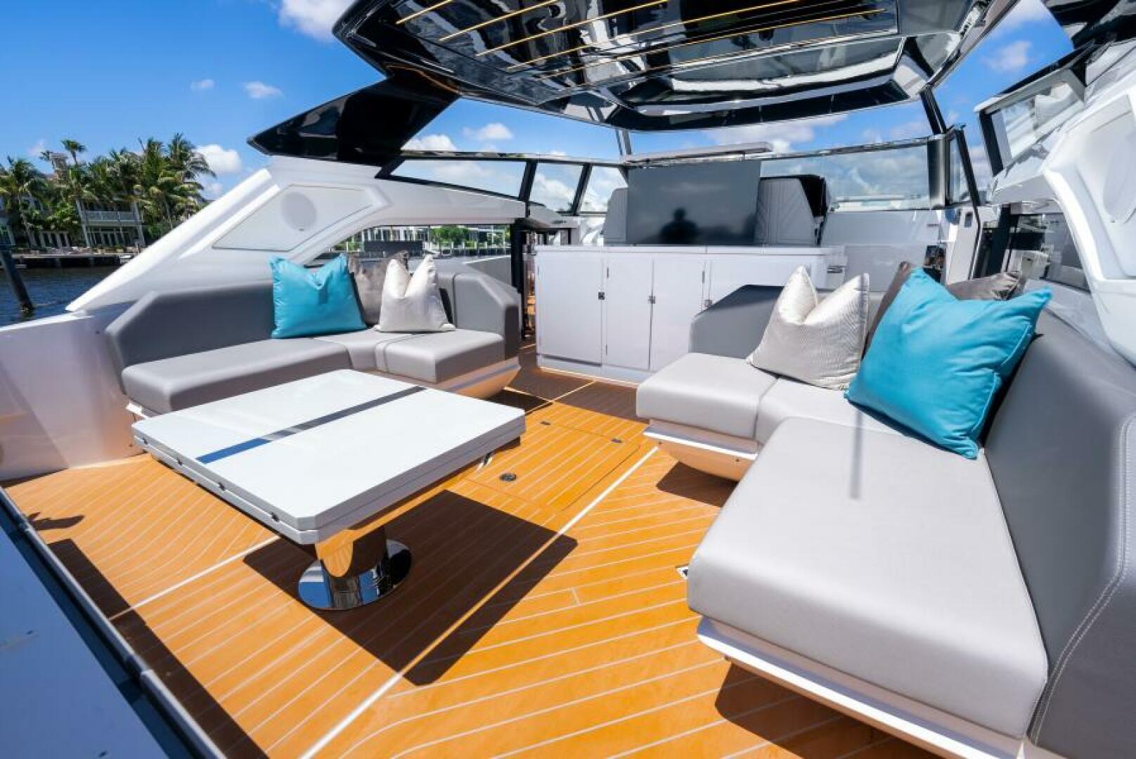 Sunseeker Superhawk 55 — wet bar TV and storage detail, roof panel