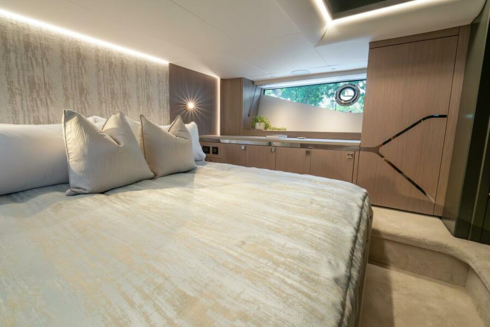 Sunseeker Superhawk 55 — VIP cabin angle, panoramic windows, storage cabinetry