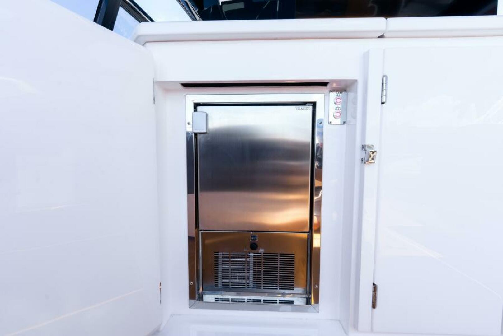 Sunseeker Superhawk 55 — cockpit refrigerator and icemaker, stainless steel, concealed hatch
