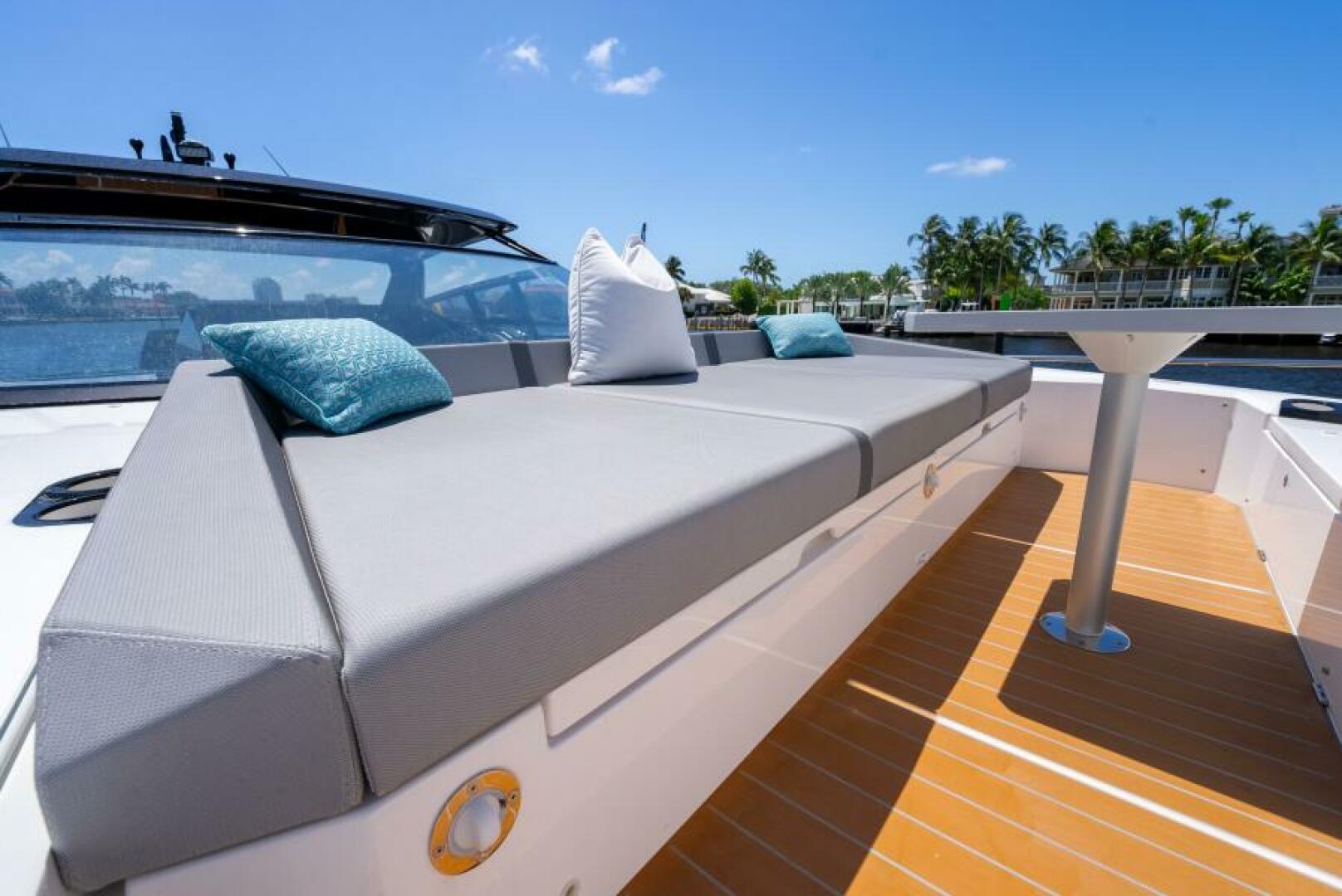 Sunseeker Superhawk 55 — starboard cockpit daybed and table, teak deck, intracoastal