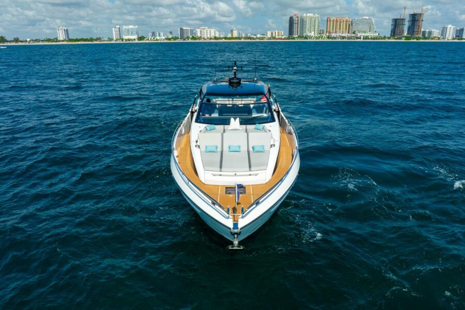 Sunseeker Superhawk 55 — starboard profile running hard, Miami skyline